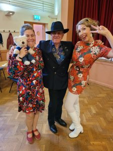 Jayne Darling performs her 1960s show in Sheffield. Pictured are a man with a hat and a last holding a teddy bear